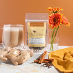 Plum Deluxe Full Moon Chai (Vanilla Butternut Masala Chai) in a lifestyle setting, showing packaging and a cup of tea.