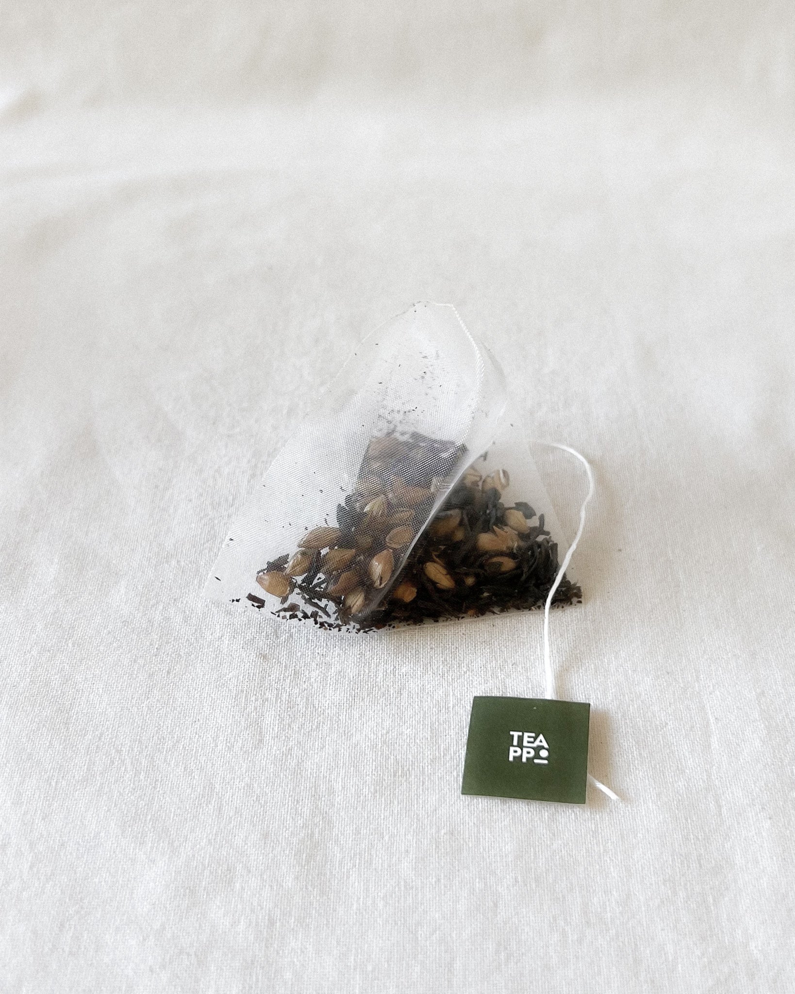 Teappo Golden Barley Black Tea package displayed in a clean setting, showcasing the product's design and branding.