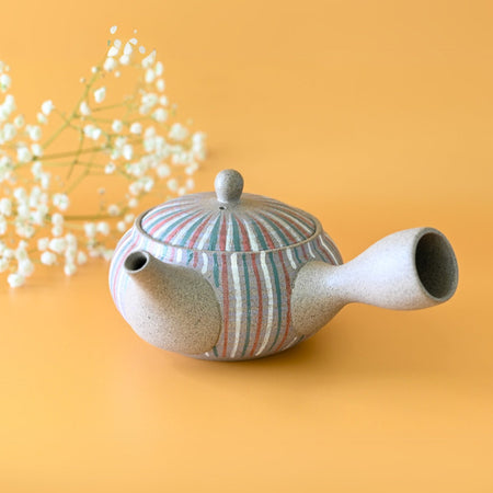 Aprika Life Handcrafted Japanese Kyusu Teapot with Filters (310ml), showcasing a ceramic teapot with an ergonomic handle and fine mesh filter.