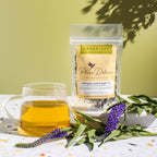 Plum Deluxe Hope Blend Green Tea (Jasmine) in a lifestyle setting, showcasing the product packaging and tea ingredients.