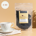 Plum Deluxe House Blend Black Tea (Creamy Vanilla English Breakfast) in a 4 oz package, shown in a product image.