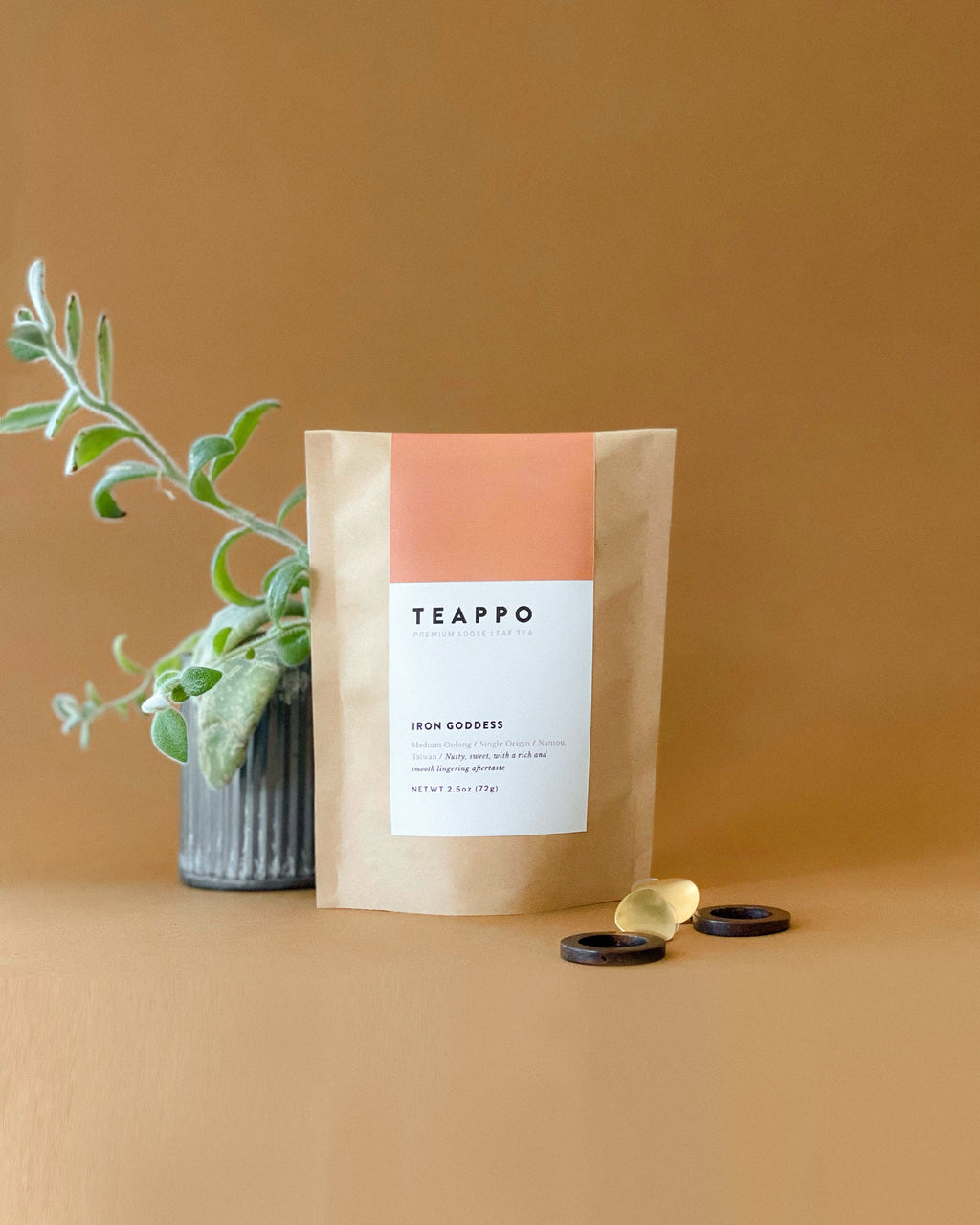 Teappo Iron Goddess oolong tea in a package, showcasing the leaves' rich, crimson-tinged edges, 2.5 oz. size.