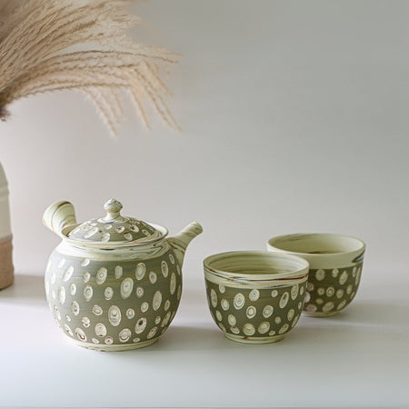 Aprika Life Japanese Kyusu Set - Teapot with Filters (370ml) and Two Cups, featuring a handmade Tokoname clay teapot and two cups.