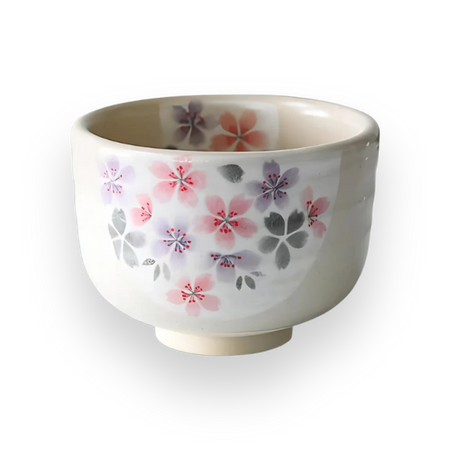 Aprika Life Kohiki Pink Sakura Ceramic Matcha Bowl, beige bowl with sakura flowers, includes bamboo whisk and holder.