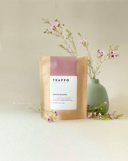 Teappo Orchid Oolong 2.5 oz package, showcasing tightly rolled semi-ball tea leaves from Nantou, Taiwan.