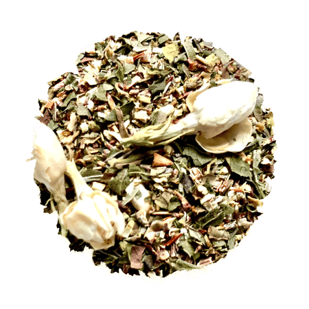 Beach House Olympic Mint Green Iced Blend in a glass, showcasing green rooibos, jasmine, peppermint, and lime peel.