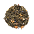 Plum Deluxe Queen's Blend Green Tea (Lemon Crème Earl Grey) in a circular package, showcasing green tea and fruit ingredients.
