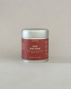 Teappo Red Oolong Powder in a tea tin, displaying rich color, ideal for tea lattes with smooth flavor notes of honey and ripe fruit.