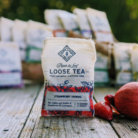 Piper and Leaf Strawberry Shindig Muslin Bag of Loose Leaf Tea - 15 Servings in hand-printed muslin bag with tea leaves visible.