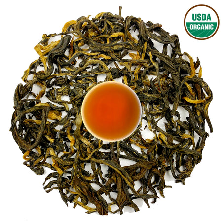 Danfe Mt. Pumori Organic Black Tea (USDA-Certified) loose-leaf tea leaves with brewed tea in a cup