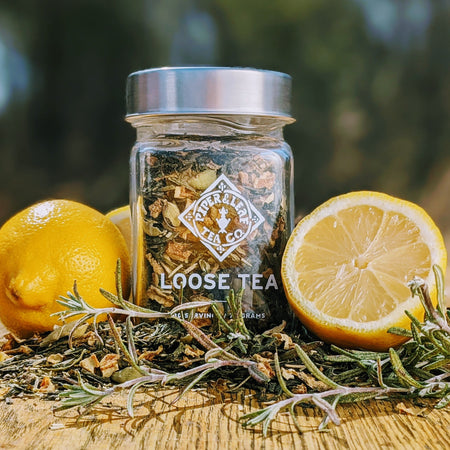 Piper and Leaf Springdrop Spritzer Glass Jar of Loose Leaf Tea - 30 Servings, showing ingredients including green tea, rosemary, and cardamom.