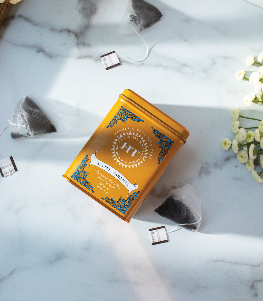 Harney & Sons Salted Caramel, HT Tin of 20 Sachets displayed in a mood setting with sachets visible in the tin.
