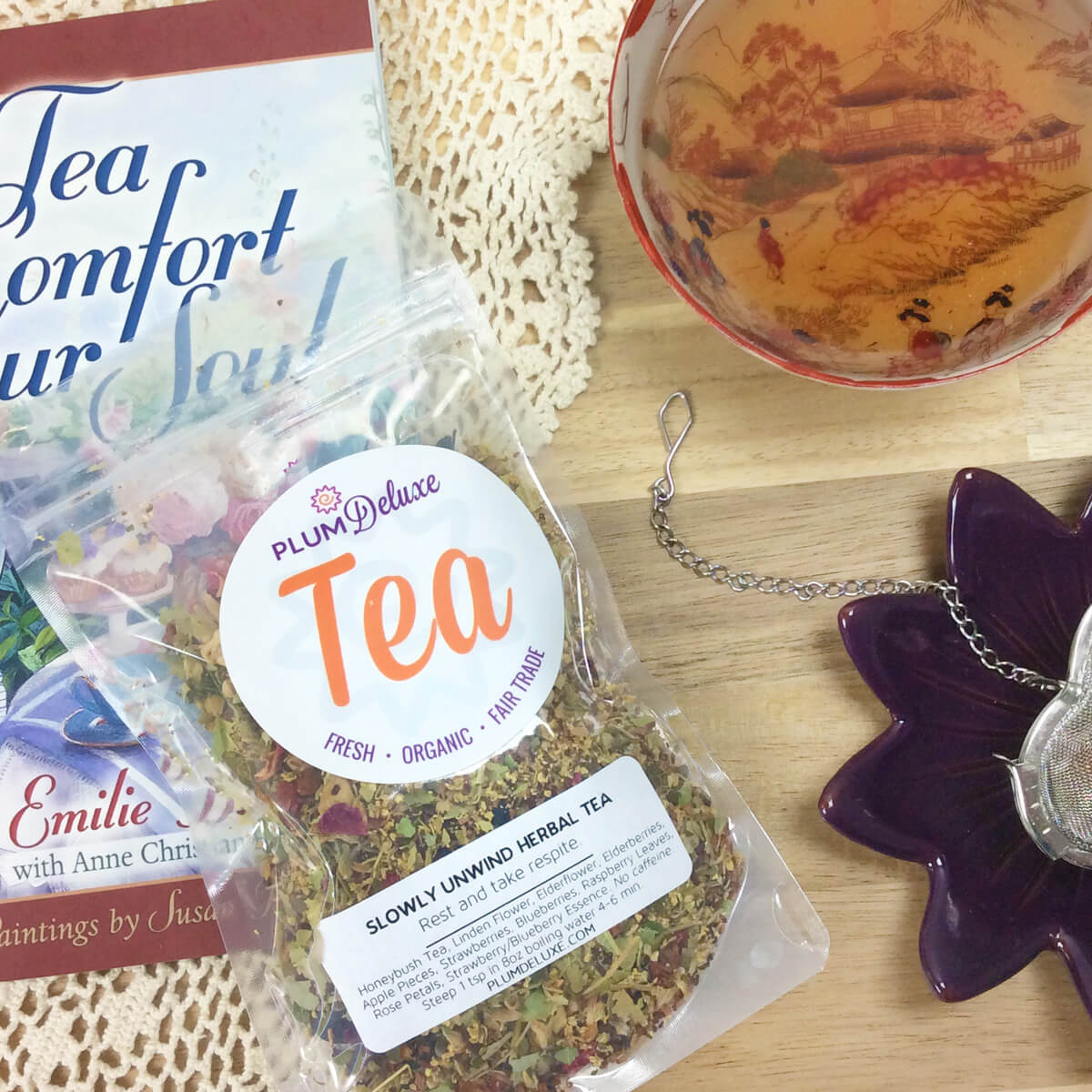 Plum Deluxe Slowly Unwind Herbal Linden Tea with linden flower, elderflower, and berry in a square packaging.