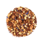 Plum Deluxe Soul Warmer Herbal Tea (Hazelnut - Chestnut - Caramel) in a circular packaging, featuring nutty caramel flavor notes.
