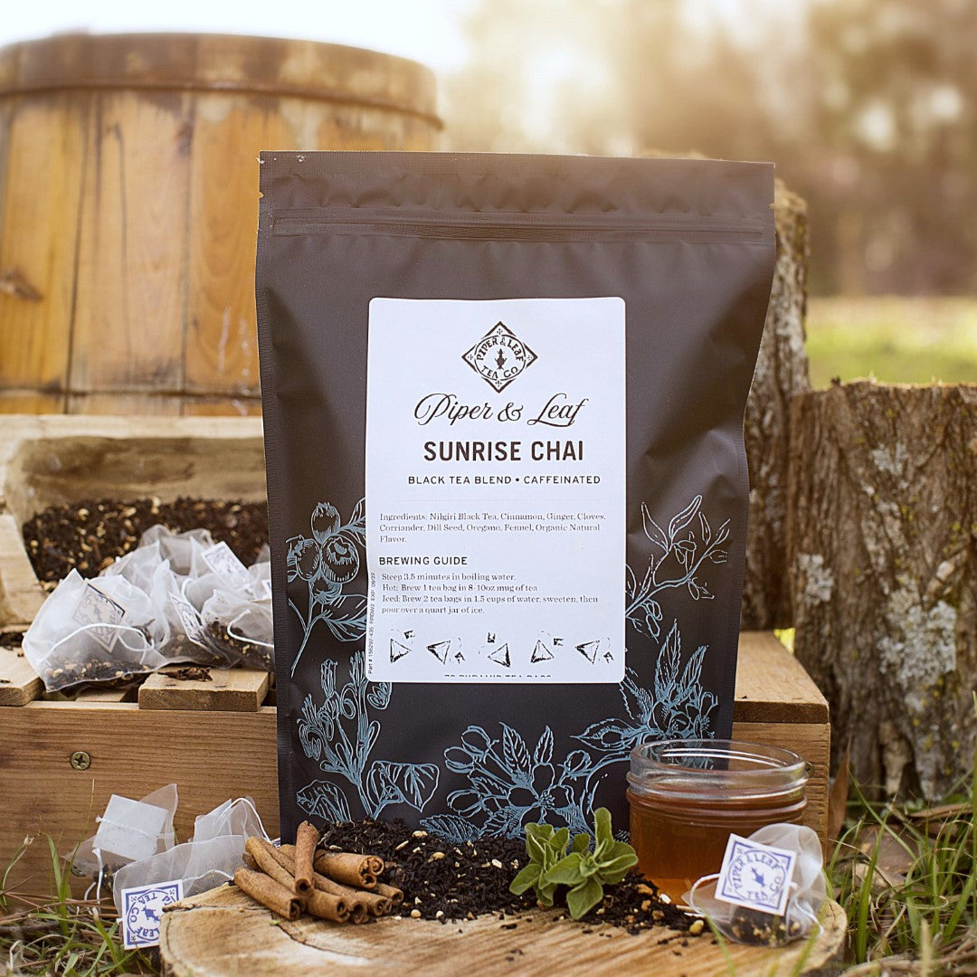 Piper and Leaf Sunrise Chai Bulk Sachets - 70ct Tea Bags, featuring a bag of chai tea bags with a spiced blend.