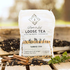 Piper and Leaf Sunrise Chai Muslin Bag of Loose Leaf Tea - 15 Servings in hand-printed muslin bag with tea blend ingredients visible.