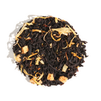Plum Deluxe Sweet Georgia Peach Black Tea (Hint of Caramel - Walnut) in a circular packaging with peach and caramel flavor notes.