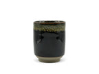 Inoue Tea Tetsu Black Mino-yaki Yunomi - Japanese Teacup displayed in image, showcasing its unique ceramic design.