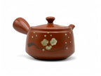 Inoue Tea Fusensaku Hakubai White Blossom Red Tokoname-yaki Kyusu - Japanese teapot with intricate white blossom design.