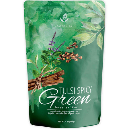 Gardenika Tulsi Spicy Green Tea with Cinnamon, Loose Leaf, USDA Organic, Kosher – 4 Oz (113g) in a package on a wooden surface.