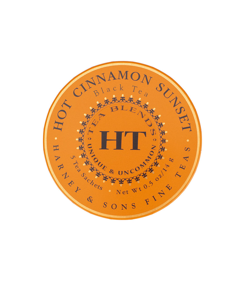 Harney & Sons Hot Cinnamon Spice tea package featuring a vibrant sunset design on the front