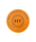 Harney & Sons Hot Cinnamon Spice tea package featuring a vibrant sunset design on the front