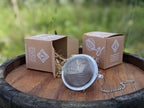 Piper and Leaf Piper Tea Ball, a tea infuser for brewing single servings, showing clasp mechanism and design for steeping loose tea.