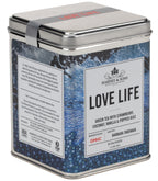 Harney & Sons Love Life, Tin of 20 Sachets, features a colorful tin containing tea sachets with a blend of green tea and fruit flavors.