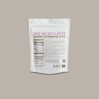 Red Velvet Latte by Somage USA in a cup, featuring a rich red color and creamy texture, with a backdrop of soft focus.