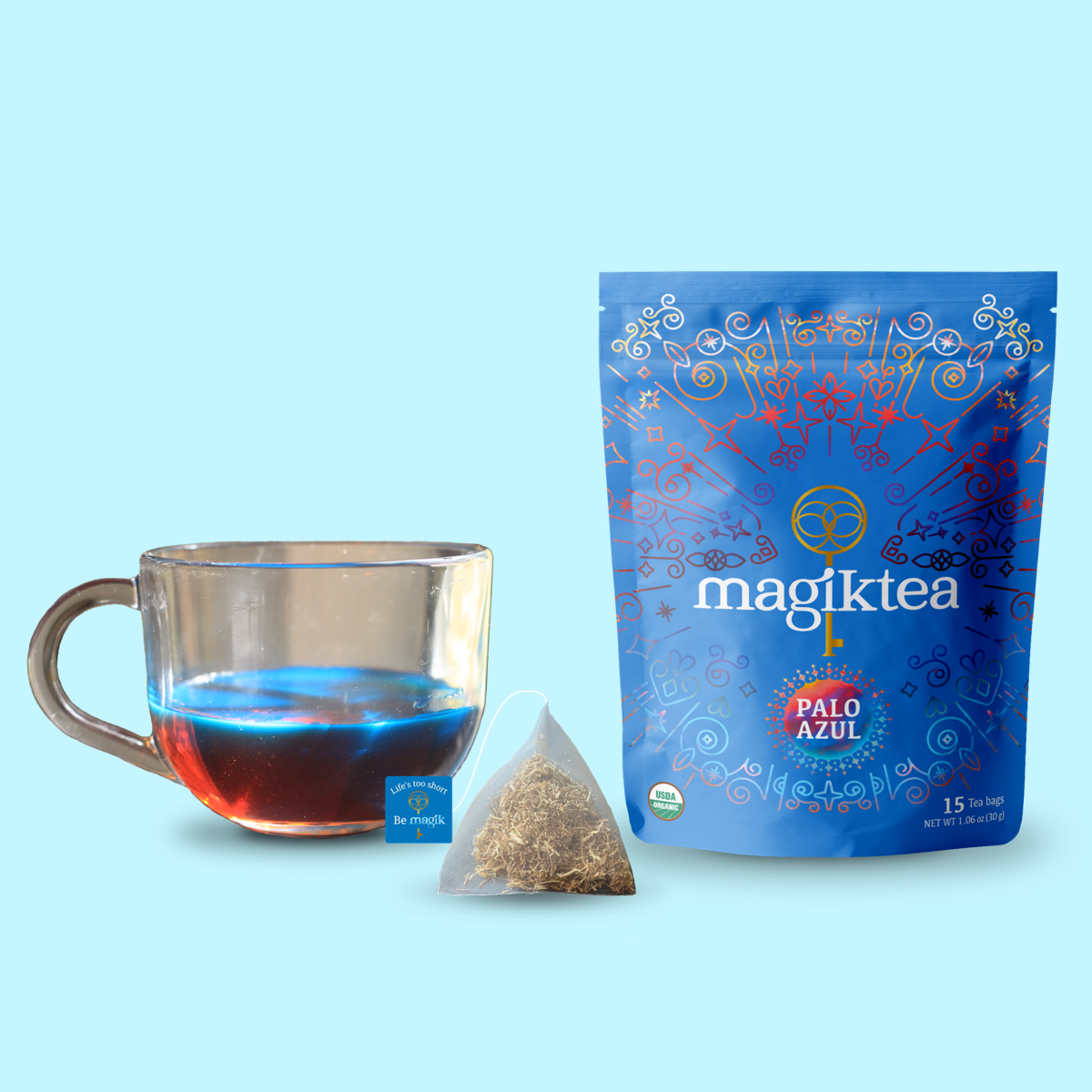 Magiktea Palo Azul tea package with a cup of tea and a tea bag on a light blue background