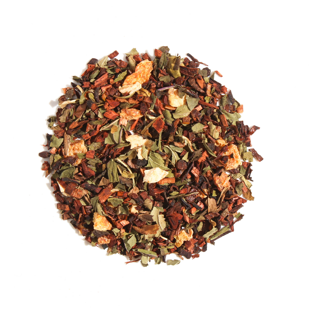 Plum Deluxe Welsh Dreams Herbal Tea (Vanilla - Lemon - Mint) in a circular packaging, featuring honeybush tea and natural ingredients.