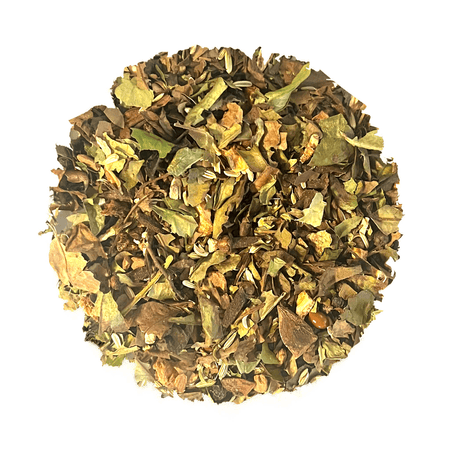 Beach House White Cap Chai in a clear glass cup with spices, showcasing organic white peony tea leaves and aromatic ingredients.
