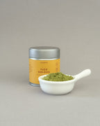 Teappo Yuzu Oolong Powder in a package, featuring a yellow label with brand logo and product details, shown on a plain background.