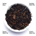 August Breakfast - Smoky Vanilla Black Tea, loose tea leaves in a bowl, featuring black tea, vanilla pieces, and smoky aroma.
