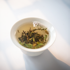 First Flush Black Tea by Nepal Tea brewing process in a teapot with leaves and steaming water