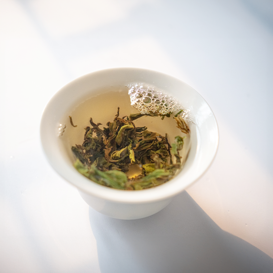 First Flush Black Tea by Nepal Tea brewing process in a teapot with leaves and steaming water