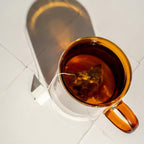 Tea with Tae Calming Tea Pouch, a soothing herbal blend, shown in a package on a neutral background.