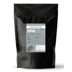 Tea with Tae Calming Tea Pouch, a calming herbal tea blend in a sealed pouch, presented with a simple design.