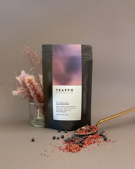 Teappo Calming Bean herbal infusion, a caffeine-free blend of roasted black beans and Taiwan red quinoa in a 2.5 oz package.