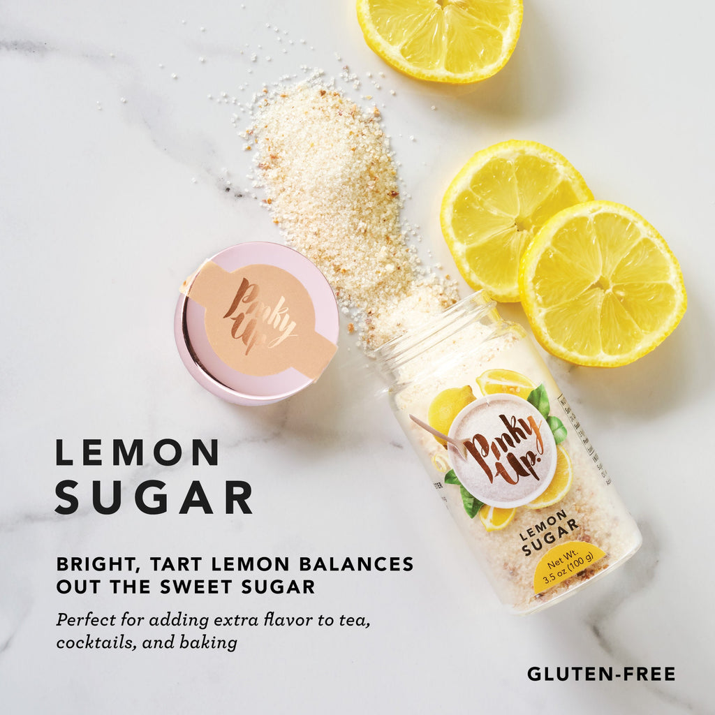 Pinky Up Lemon Sugar, a jar of lemon-flavored sugar with a clear lid, displayed against a plain background.