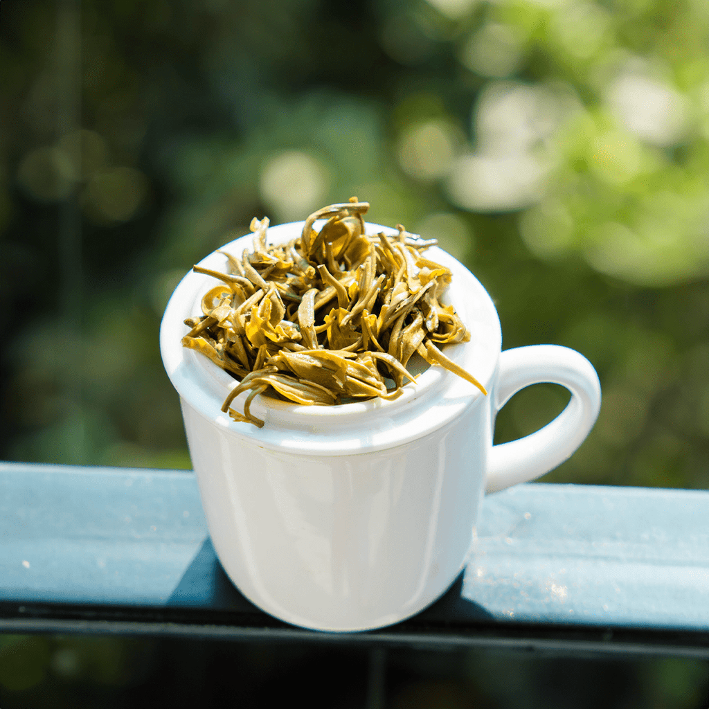 Farmers' Green by Nepal Tea, showing wet green tea leaves in a close-up image