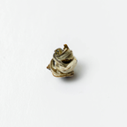 Farmers' Green by Nepal Tea, featuring a single green tea leaf on a white background