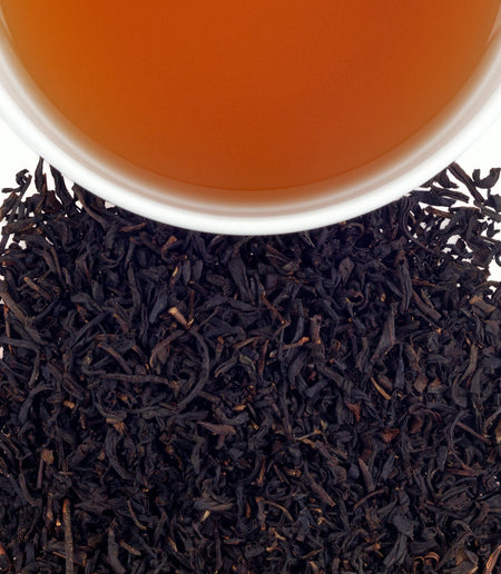 Harney & Sons Vanilla Black tea bag and loose tea leaves, showcasing the rich flavor and natural sweetness of vanilla and black tea.