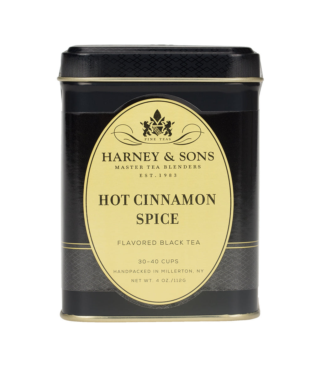 Harney & Sons Hot Cinnamon Spice tea box with vibrant packaging on a neutral background, by Harney & Sons.