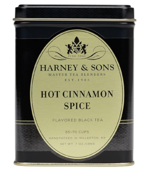 Harney & Sons Hot Cinnamon Spice tea package by Harney & Sons, featuring a vibrant design and a sealed bag of loose tea.
