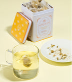 Harney & Sons Chamomile Herbal, Classic Tin of 20 Sachets, featuring a tin filled with tea sachets for brewing herbal tea.