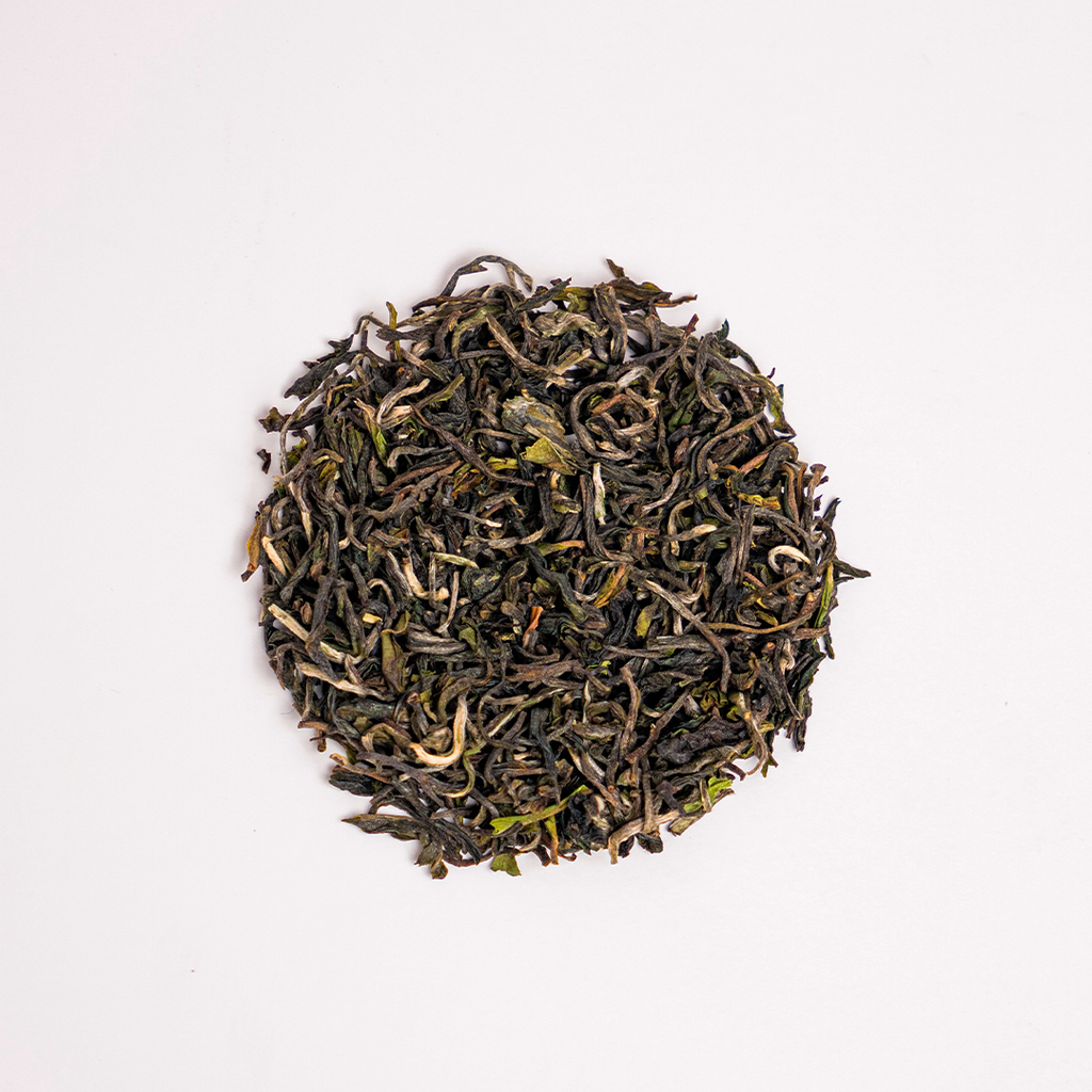 First Flush Black Tea by Nepal Tea, showing loose tea leaves in a close-up view