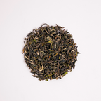First Flush Black Tea by Nepal Tea, showing loose tea leaves in a close-up view