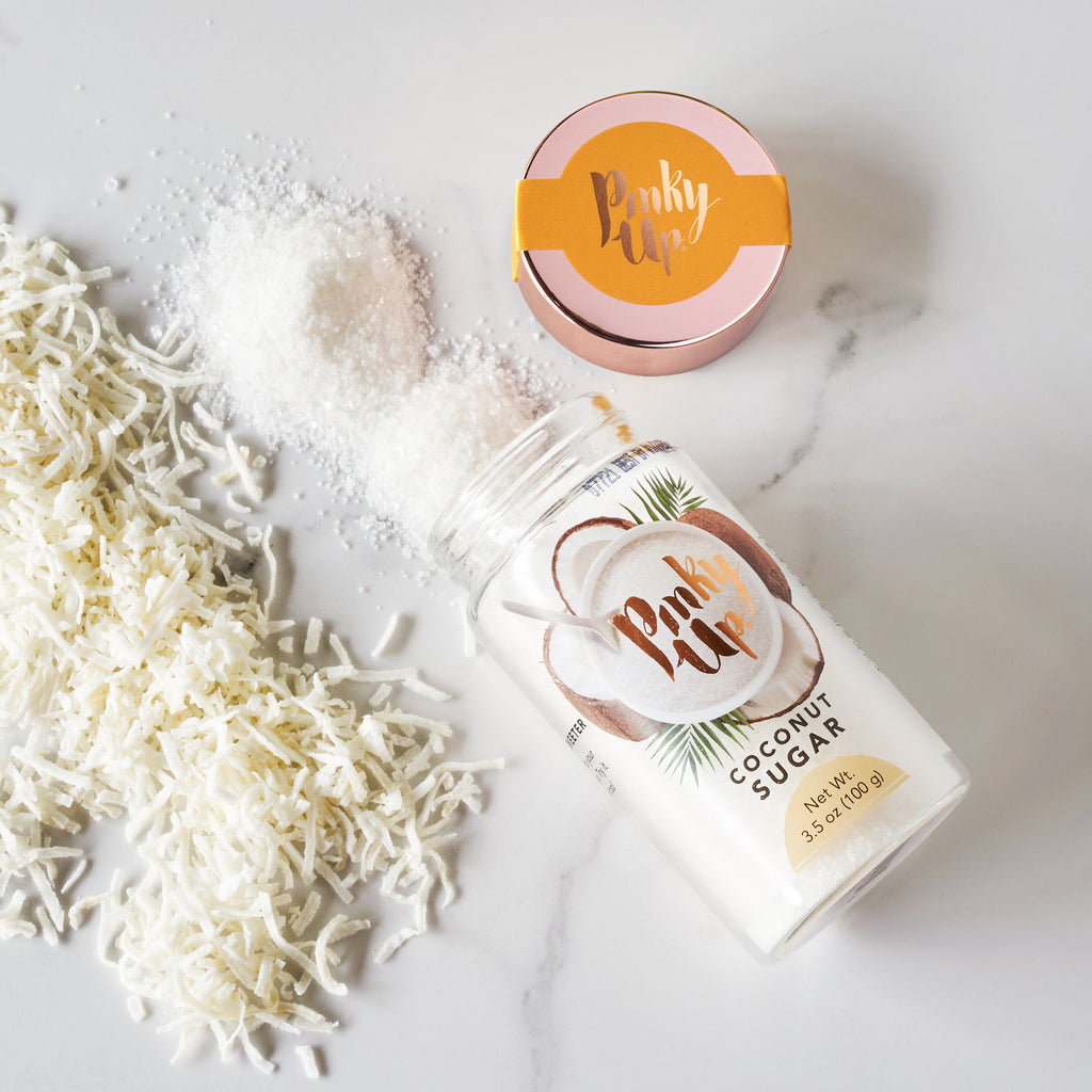 Pinky Up Coconut Sugar in a clear bag, showcasing its natural brown sugar texture against a neutral background.