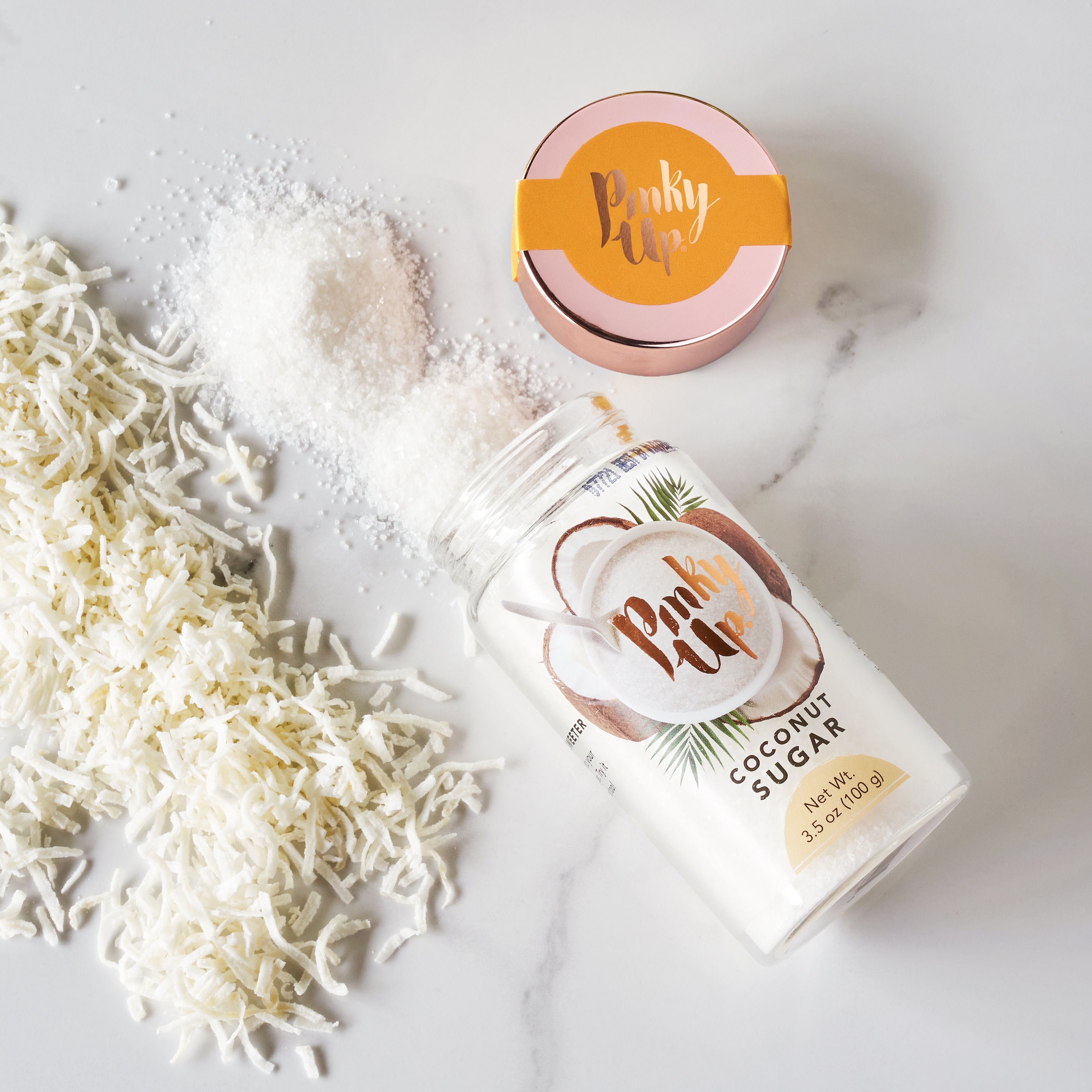 Pinky Up Coconut Sugar in a clear bag, showcasing its natural brown sugar texture against a neutral background.